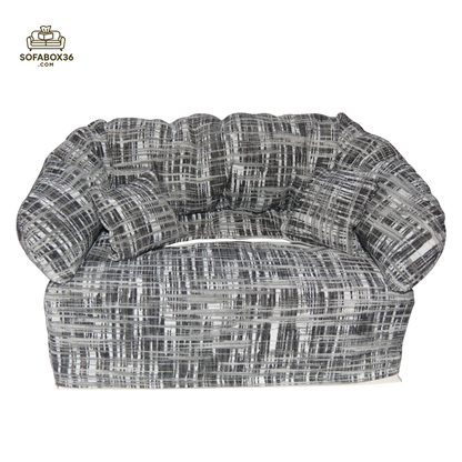 Tissue box cover depicted as a sofa (black and white).