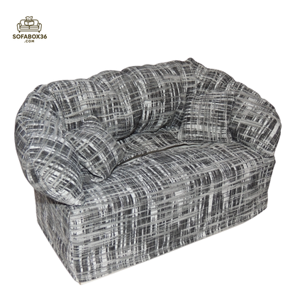 Tissue box cover depicted as a sofa (black and white).