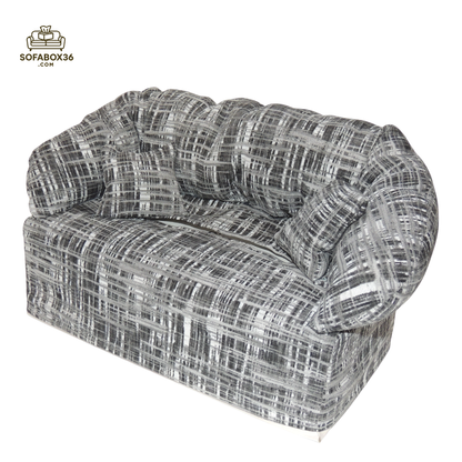 Tissue box cover depicted as a sofa (black and white).