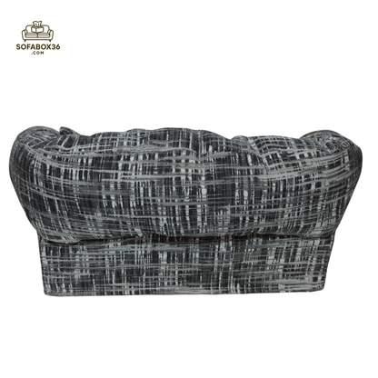 Tissue box cover depicted as a sofa (black and white).